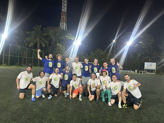 A group of people, including Moritz, posing after an intense soccer competition.